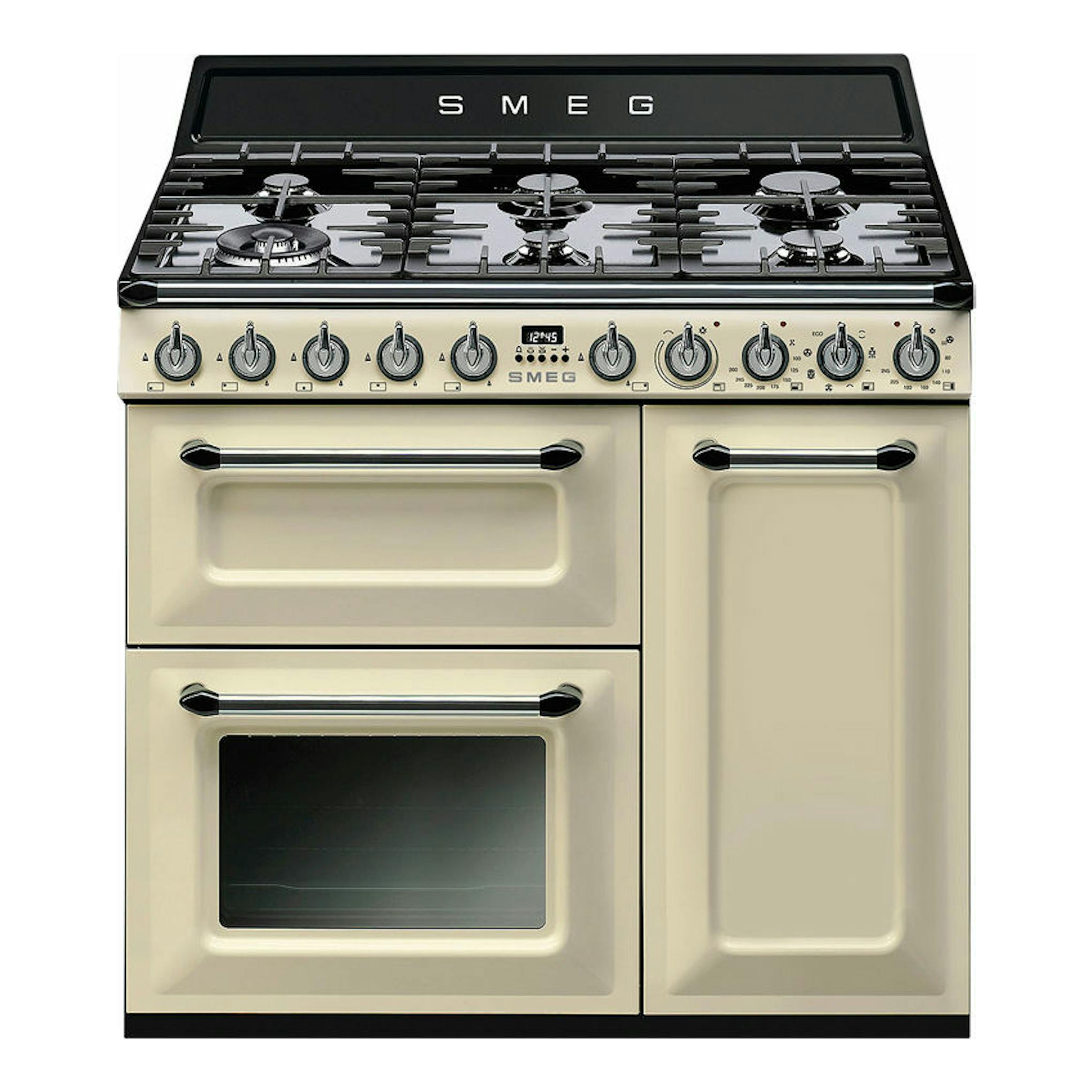 Cocina Smeg TR93P de 90 cm, crema y negro, vista frontal, con placa de gas y tres hornos.