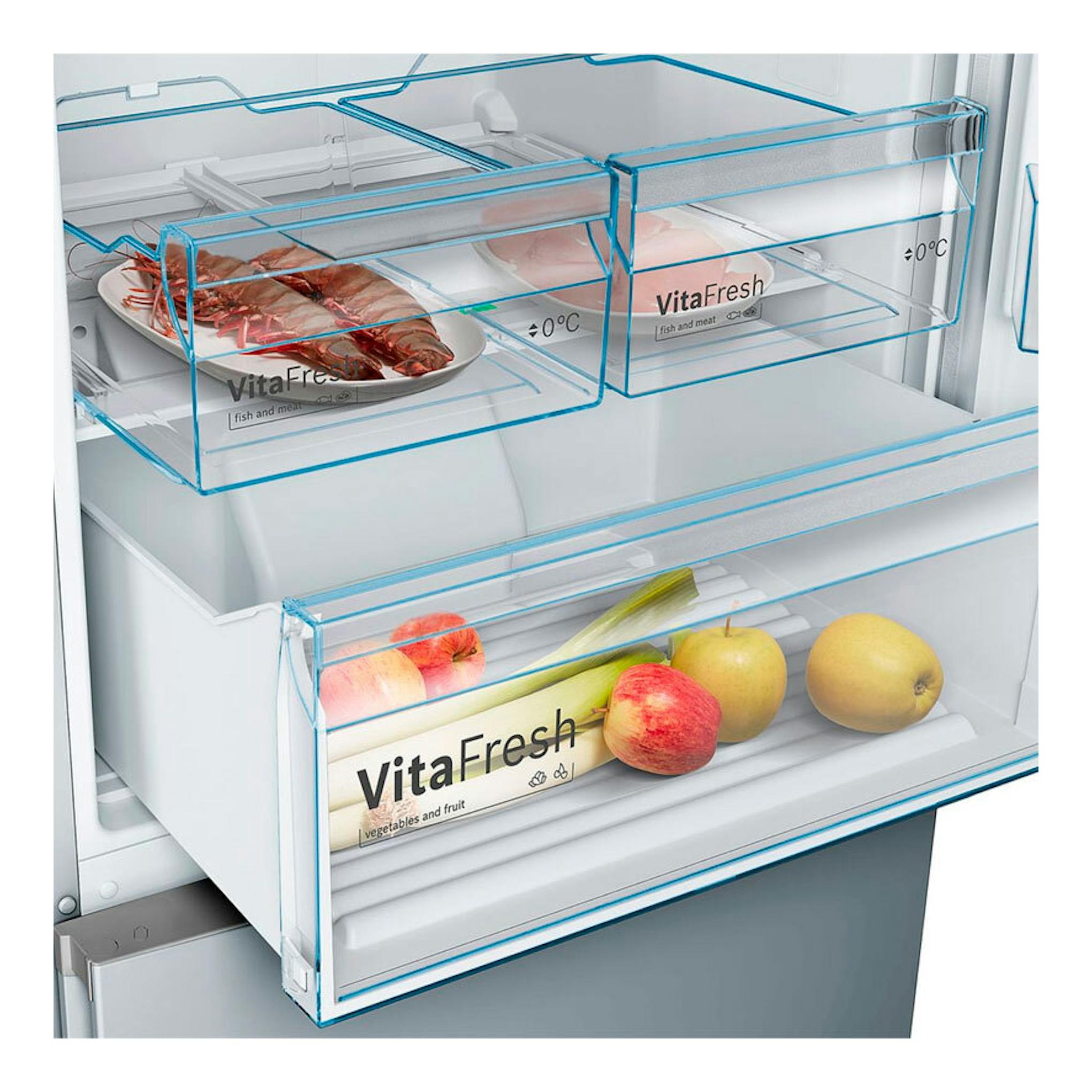 Interior de frigorífico Bosch KGN493IDA en vista frontal, con cajones VitaFresh transparentes y fruta.