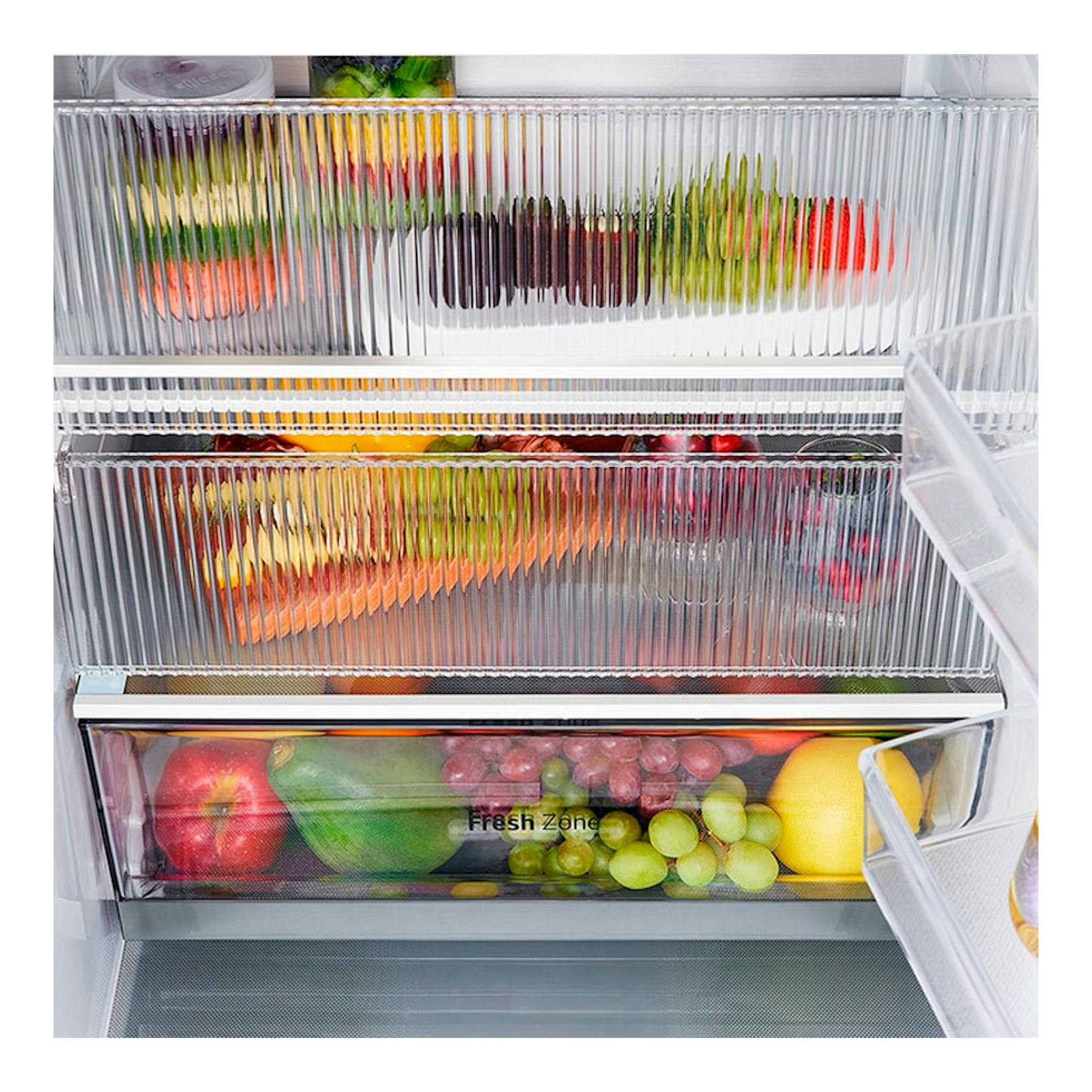 LG GBG5160CPY Inox, interior de frigorífico combi con cajones transparentes y fruta y verdura almacenadas.