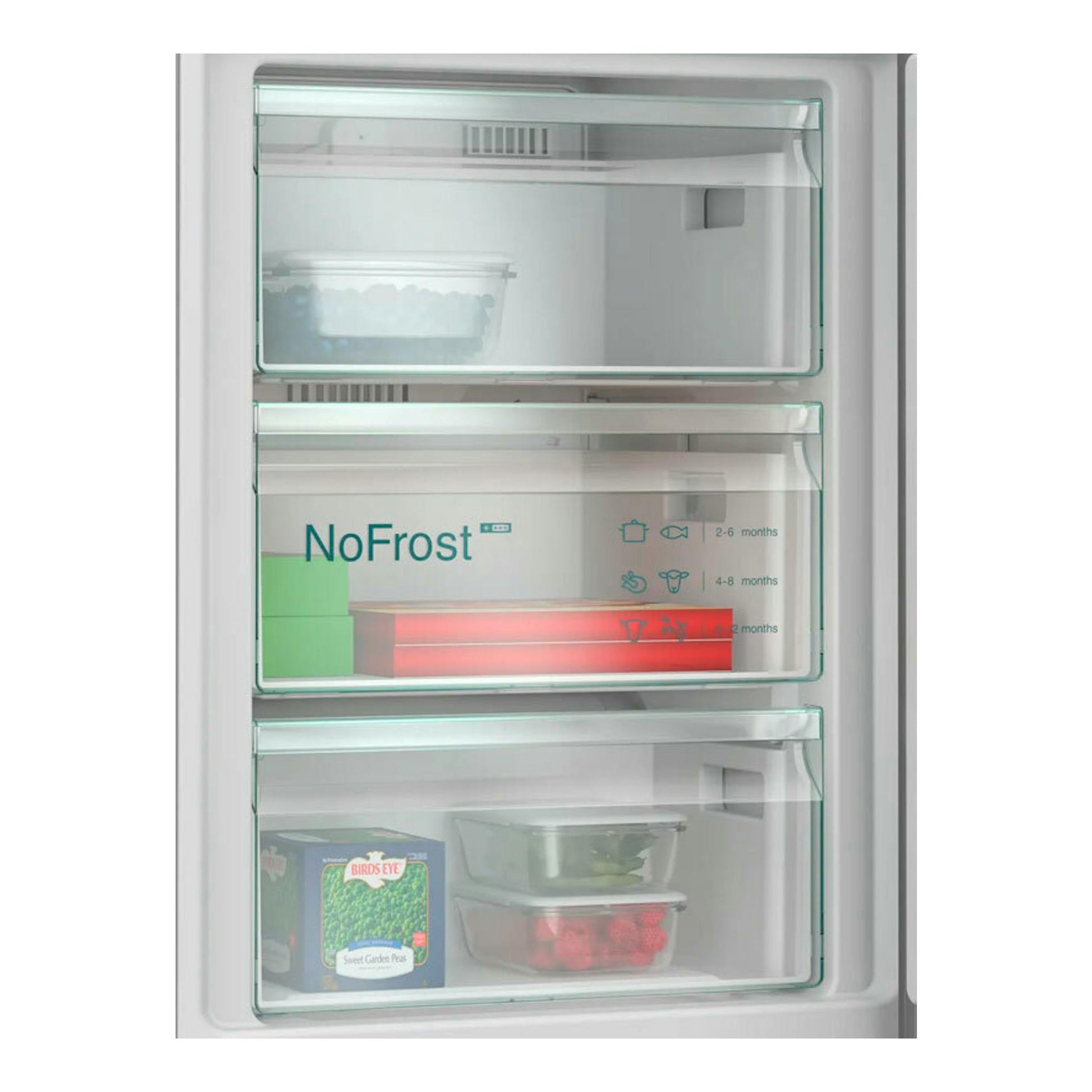 Interior del congelador de un frigorífico combi Siemens KG39N2IAG Inox, con cajones transparentes y alimentos.