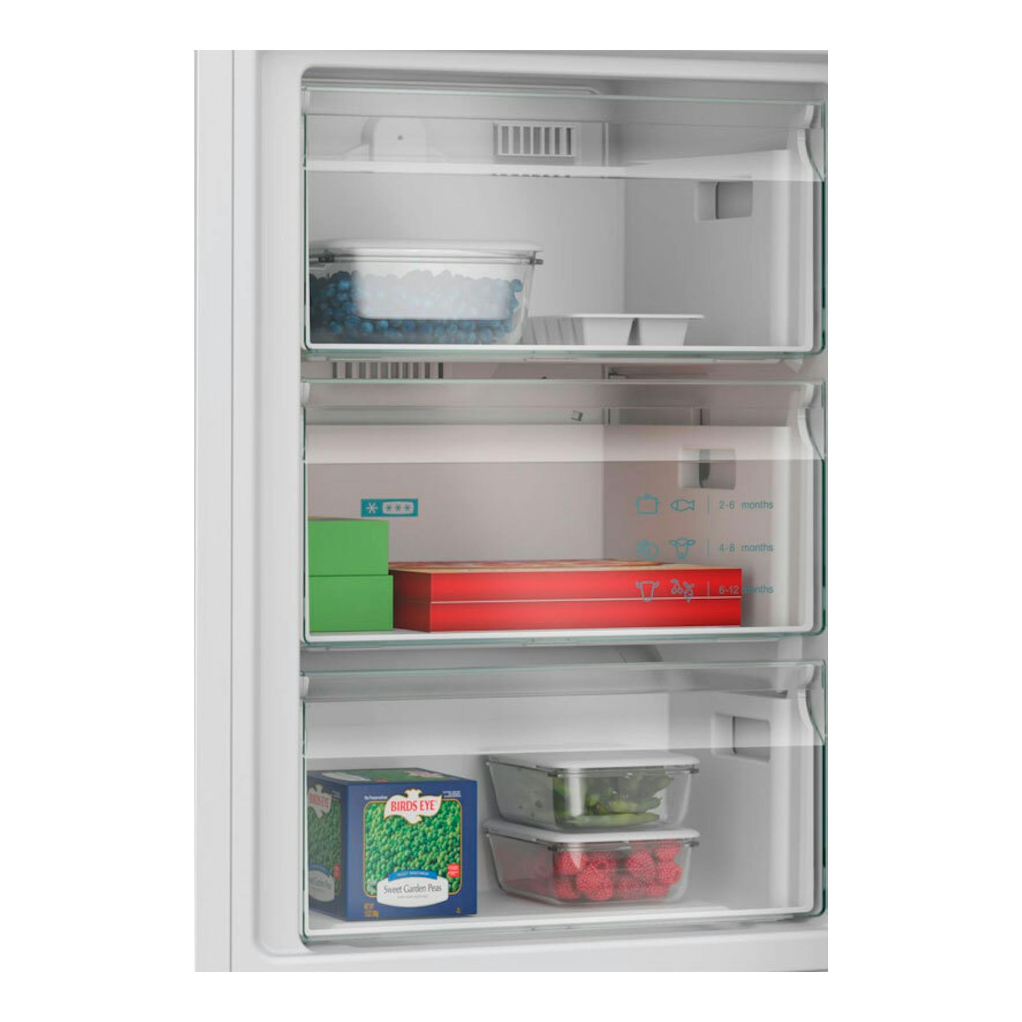 Frigorífico combi Siemens KG39NVWDG blanco, interior del congelador en vista frontal con cajones y alimentos.
