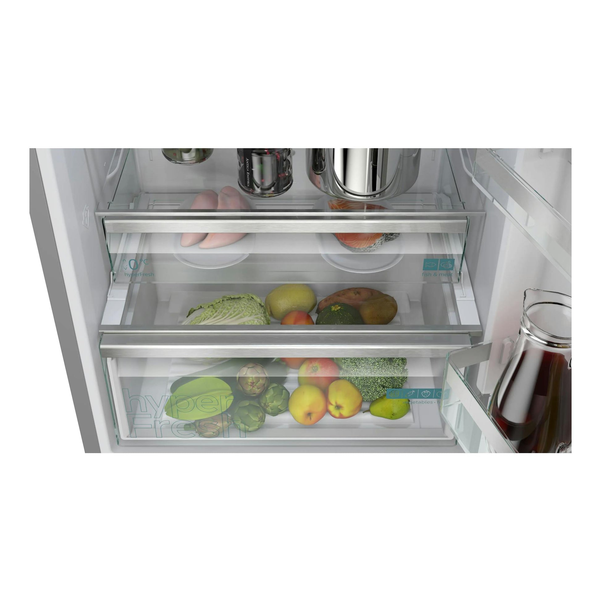 Frigorífico combi Siemens KG49NVIDG, interior en vista frontal con cajones de vidrio y alimentos.
