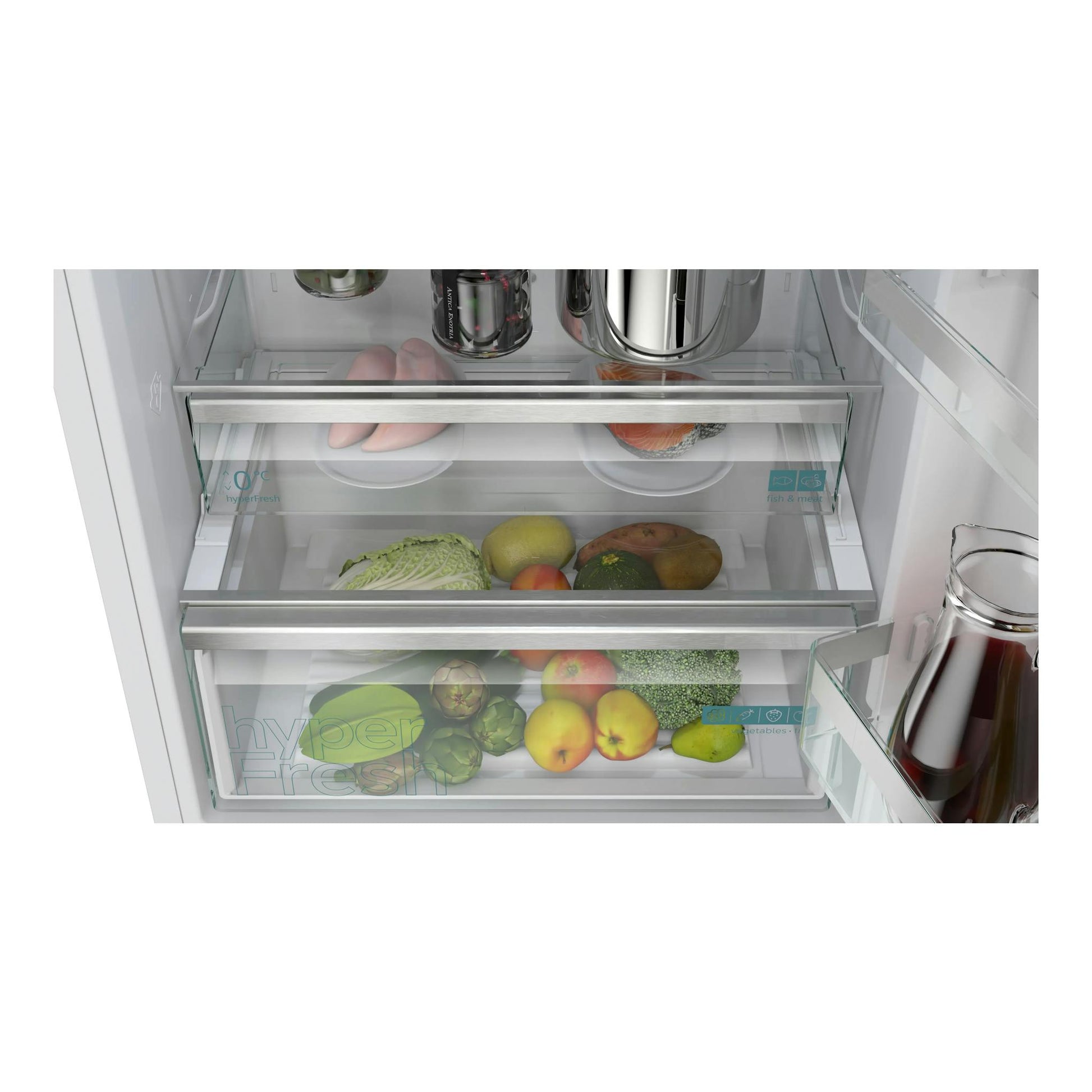 Vista interior del frigorífico combi Siemens KG49NVWDG, blanco, con cajones de vidrio y verduras.