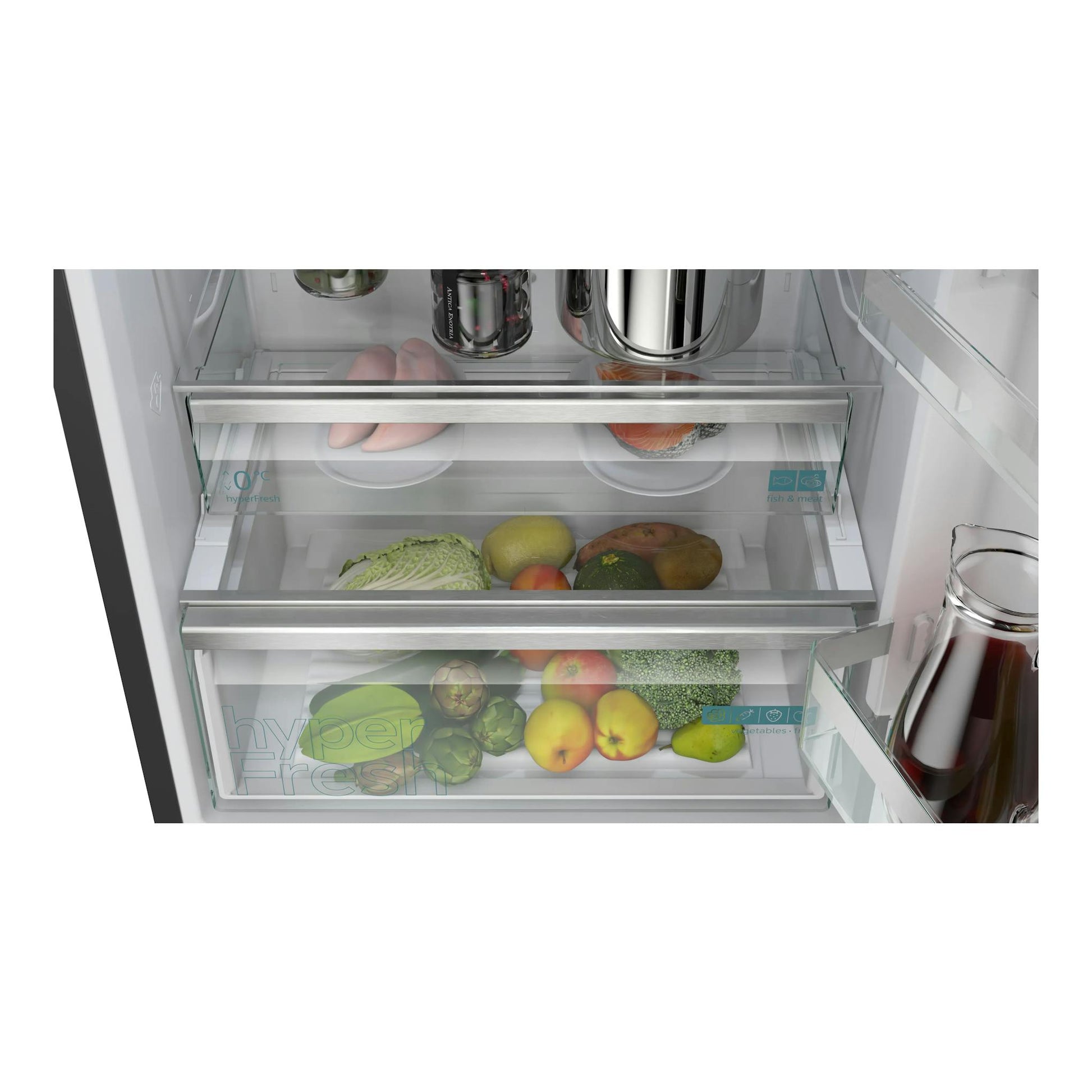 Interior de frigorífico combi Siemens KG49NVXCG, con cajones HyperFresh y alimentos, vista frontal.
