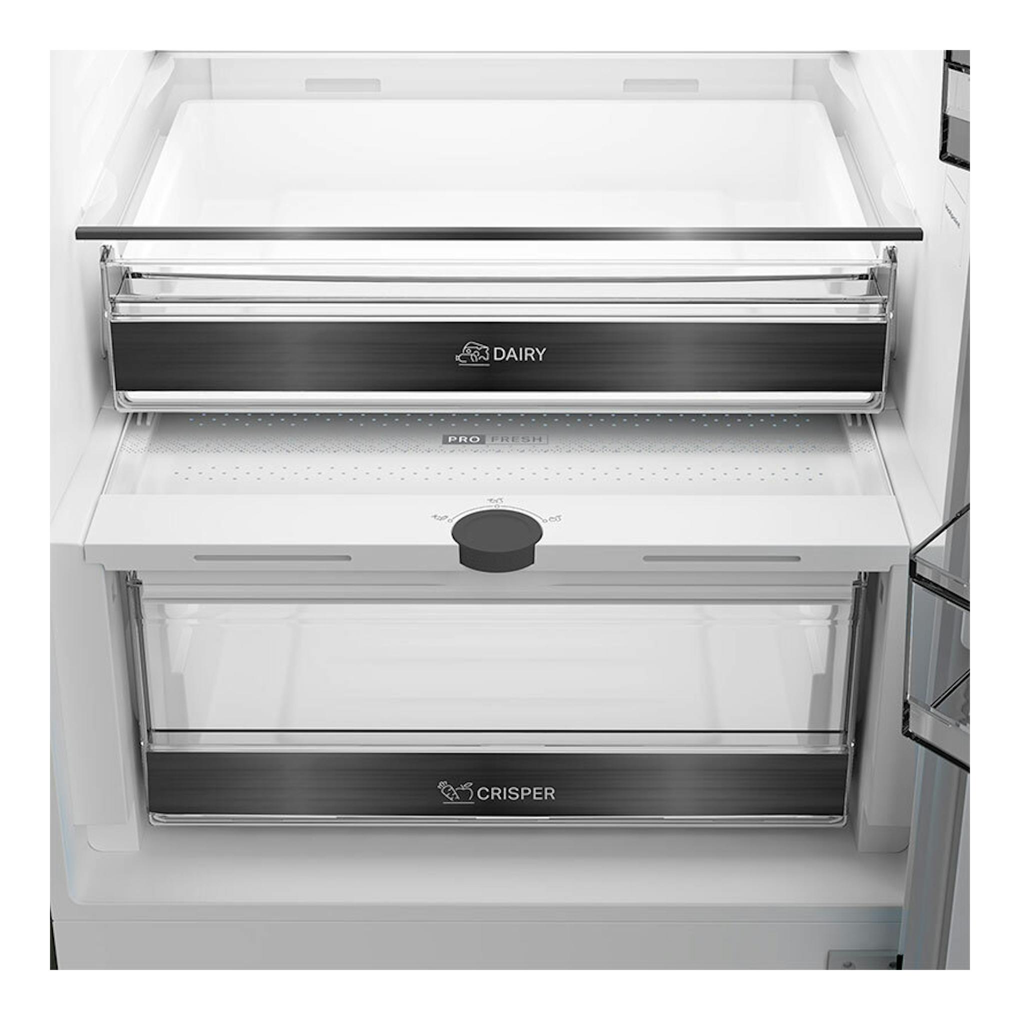 Interior de frigorífico Whirlpool WHK 22412 X5EE, vista frontal de cajones blancos y negros para lácteos y verduras.