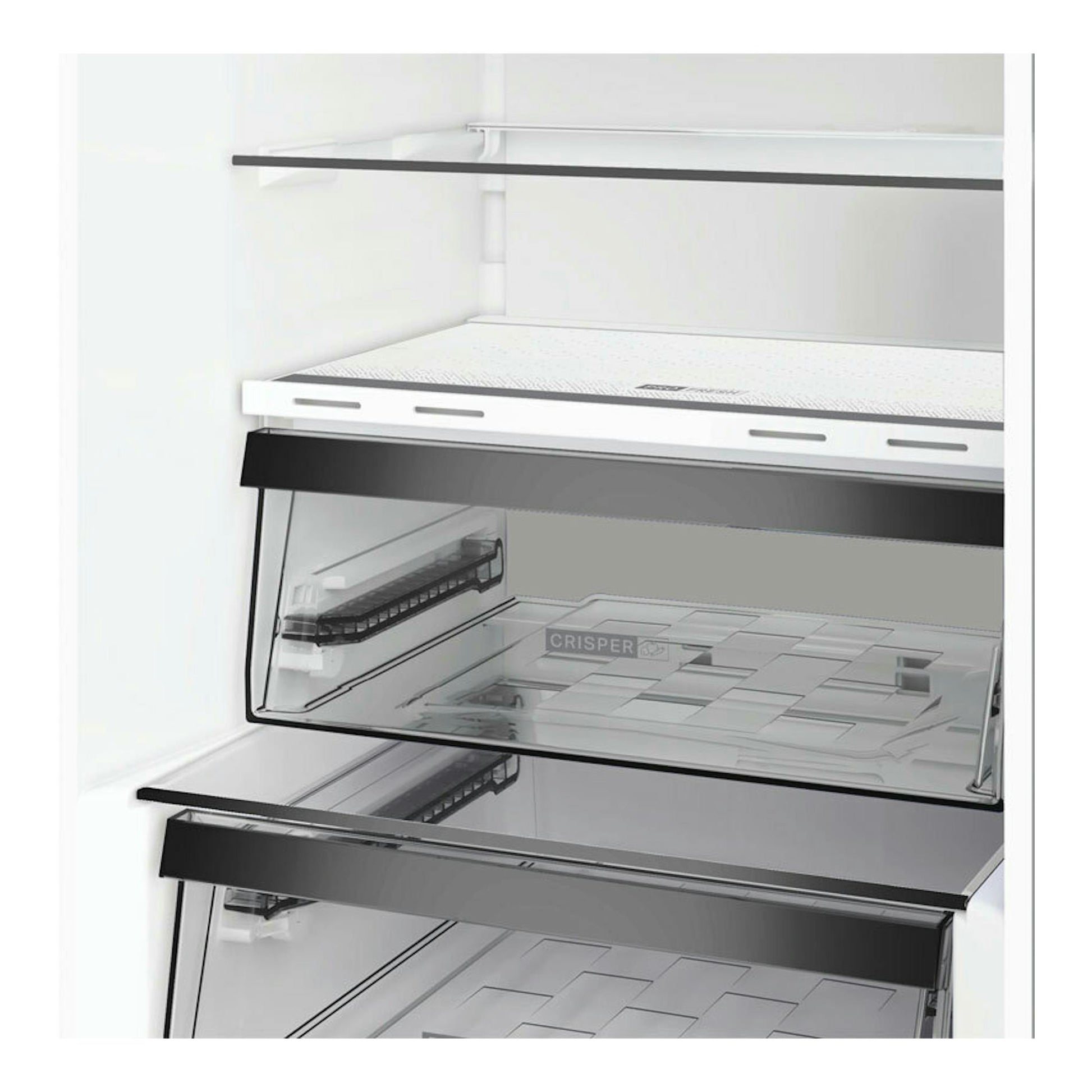 Vista interior de frigorífico combi Whirlpool WHK26403XP6E en inox perlado, con cajones y baldas de cristal.