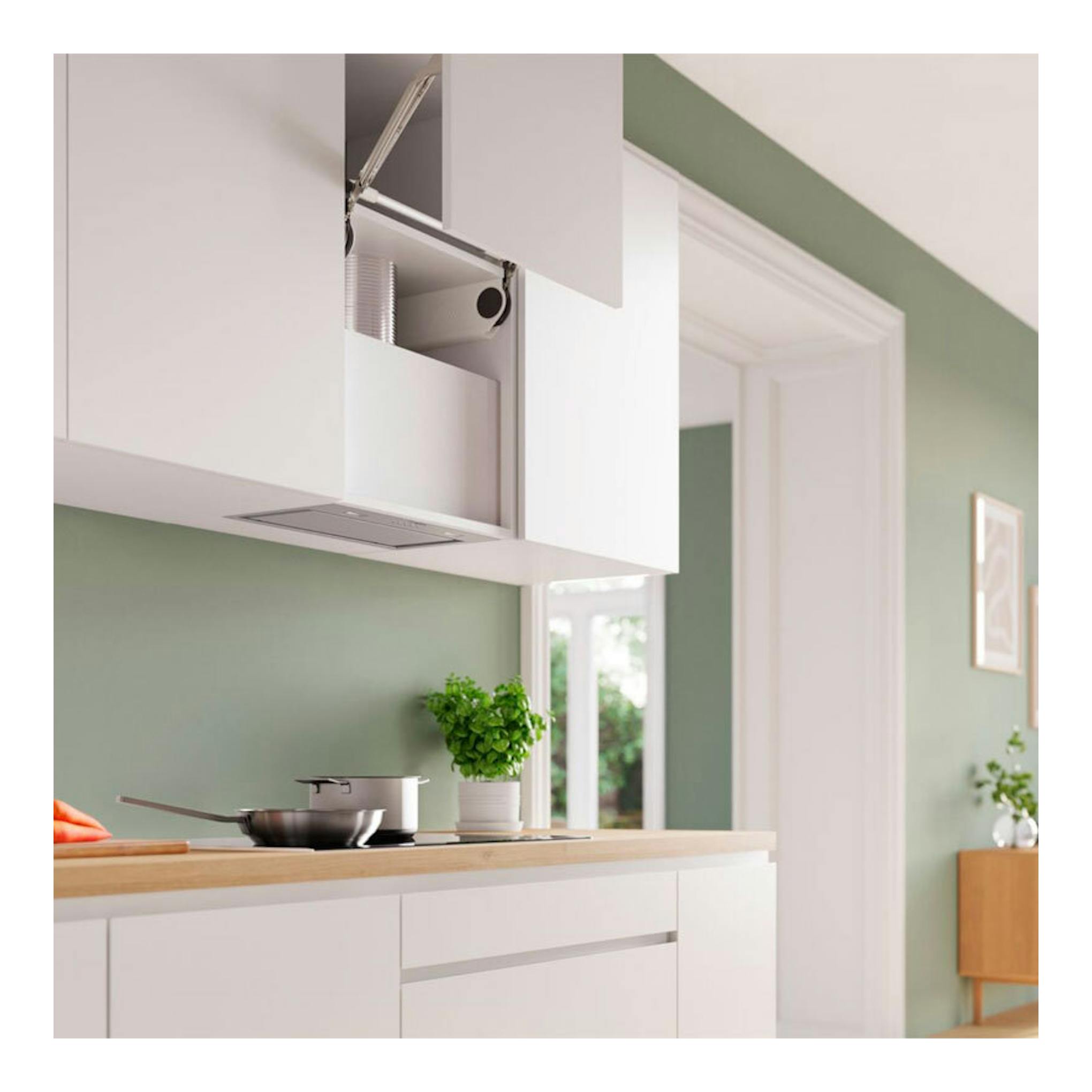 Grupo filtrante Bosch DLN56AC50 inox, vista frontal parcial, empotrado en mueble alto de una cocina blanca.