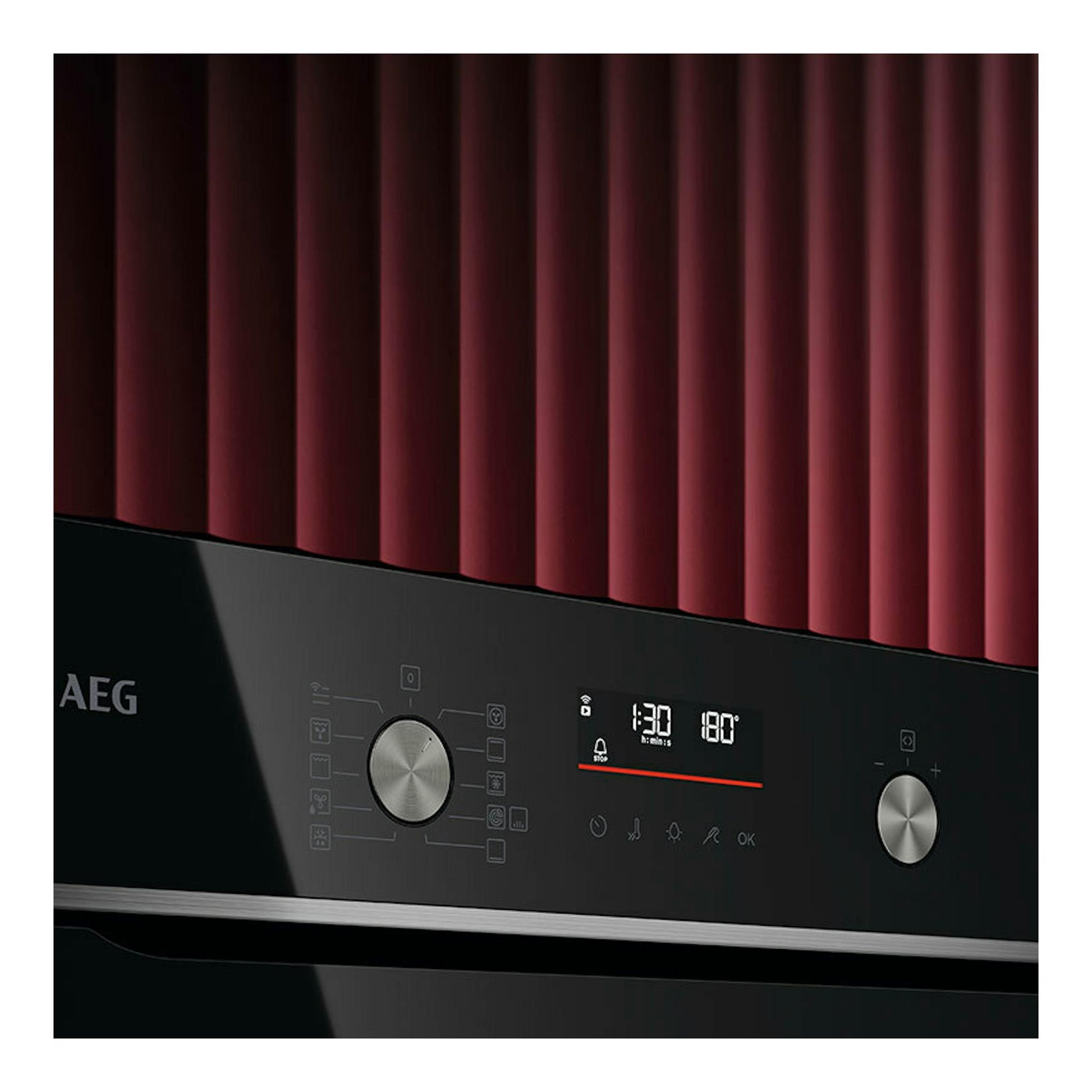 Horno AEG GS6PB51FAB negro, vista frontal parcial con panel digital y dos mandos plateados.