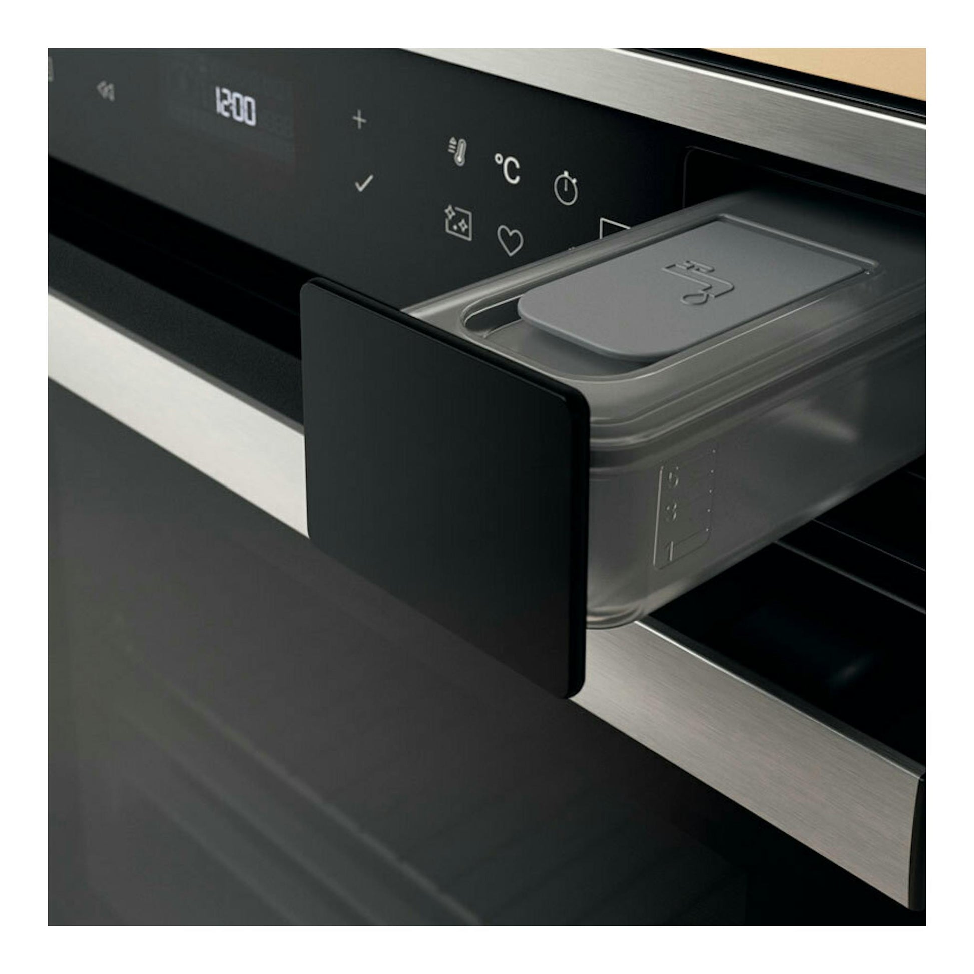 Horno Whirlpool WOI6A8PT1SXA inox, primer plano del panel negro y compartimento extraíble lateral.