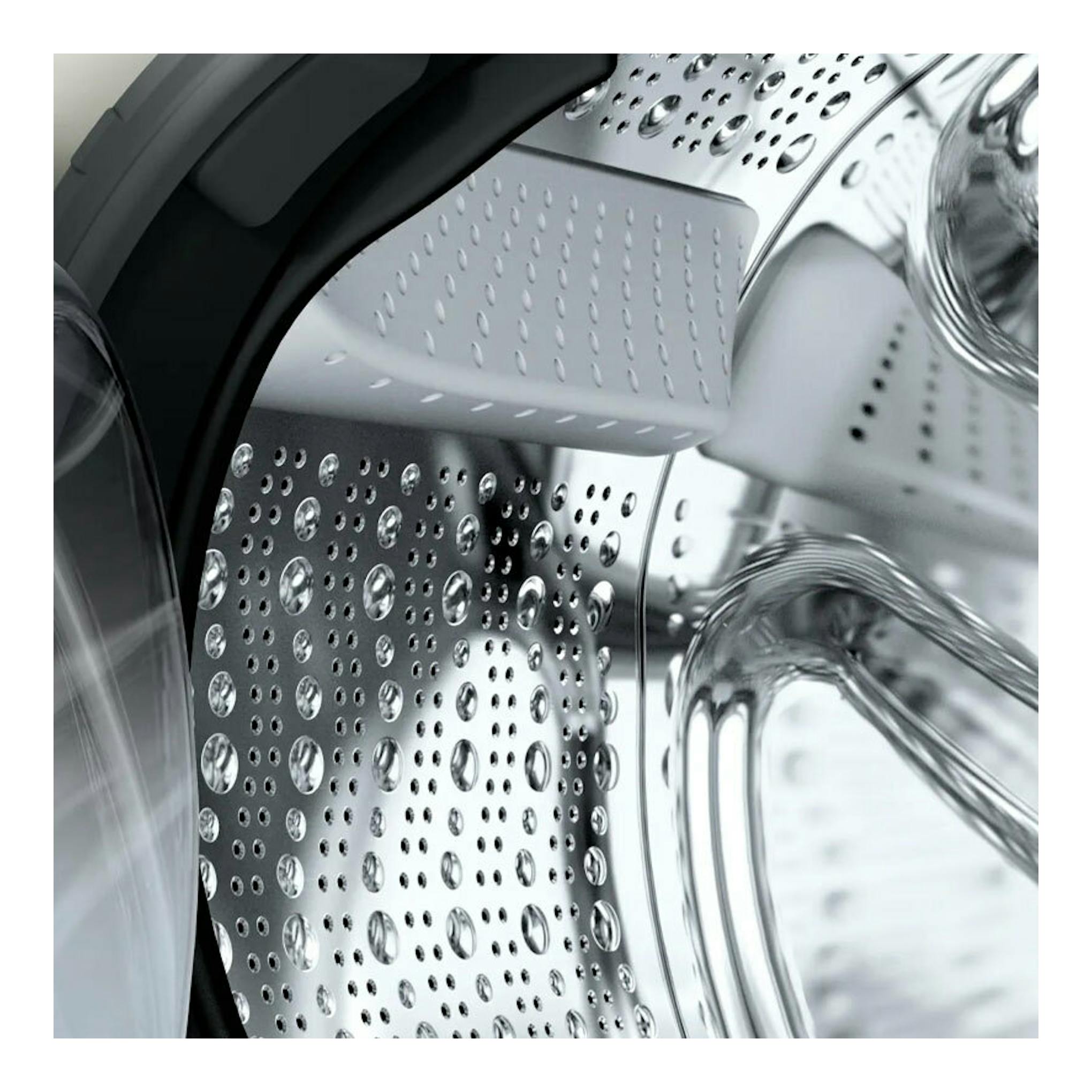 Lavadora Bosch WGH244A0ES 9 kg, vista frontal del tambor interior de acero inoxidable.