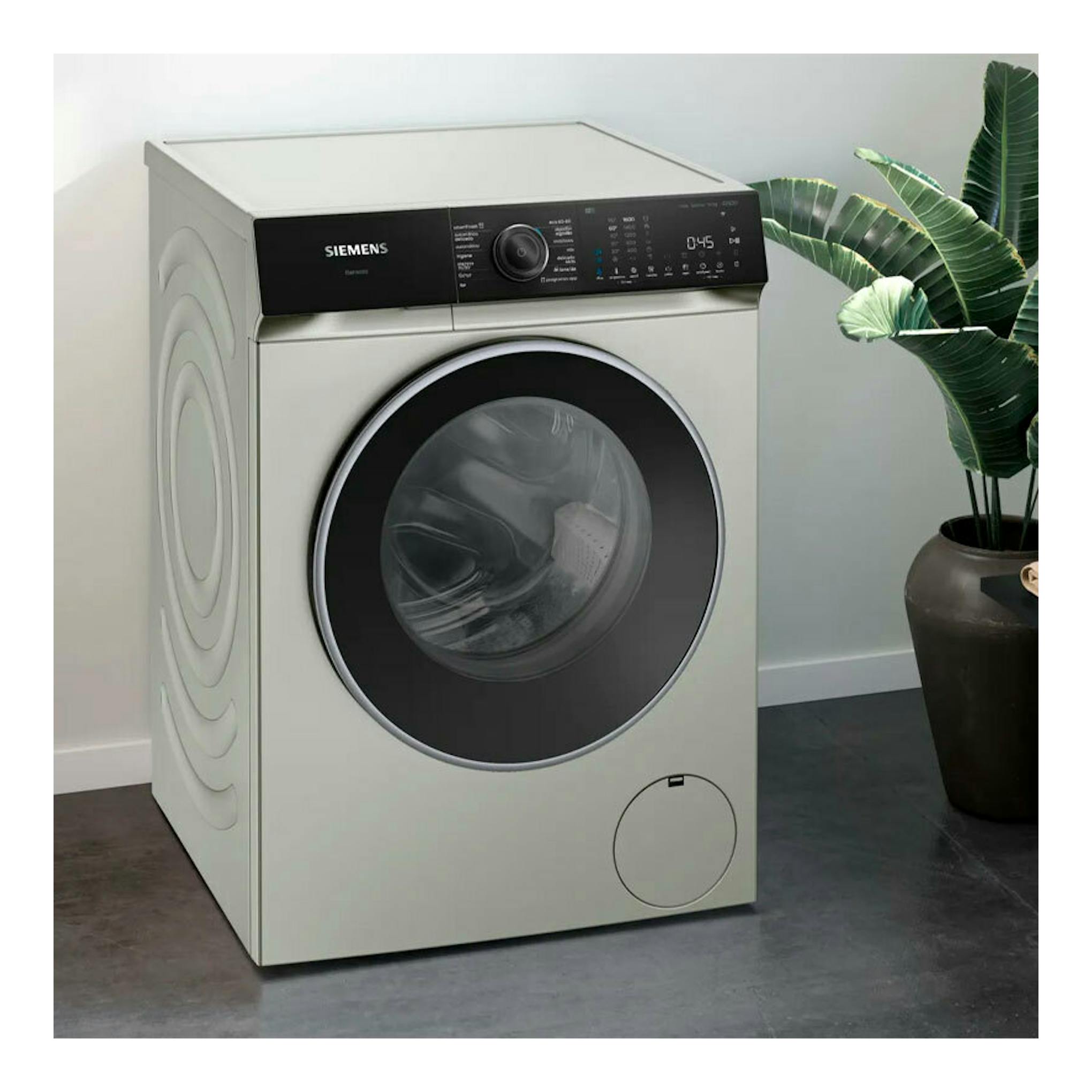 Lavadora frontal Siemens WG56H2AXES, gris claro, vista frontal, puerta circular negra y panel negro.