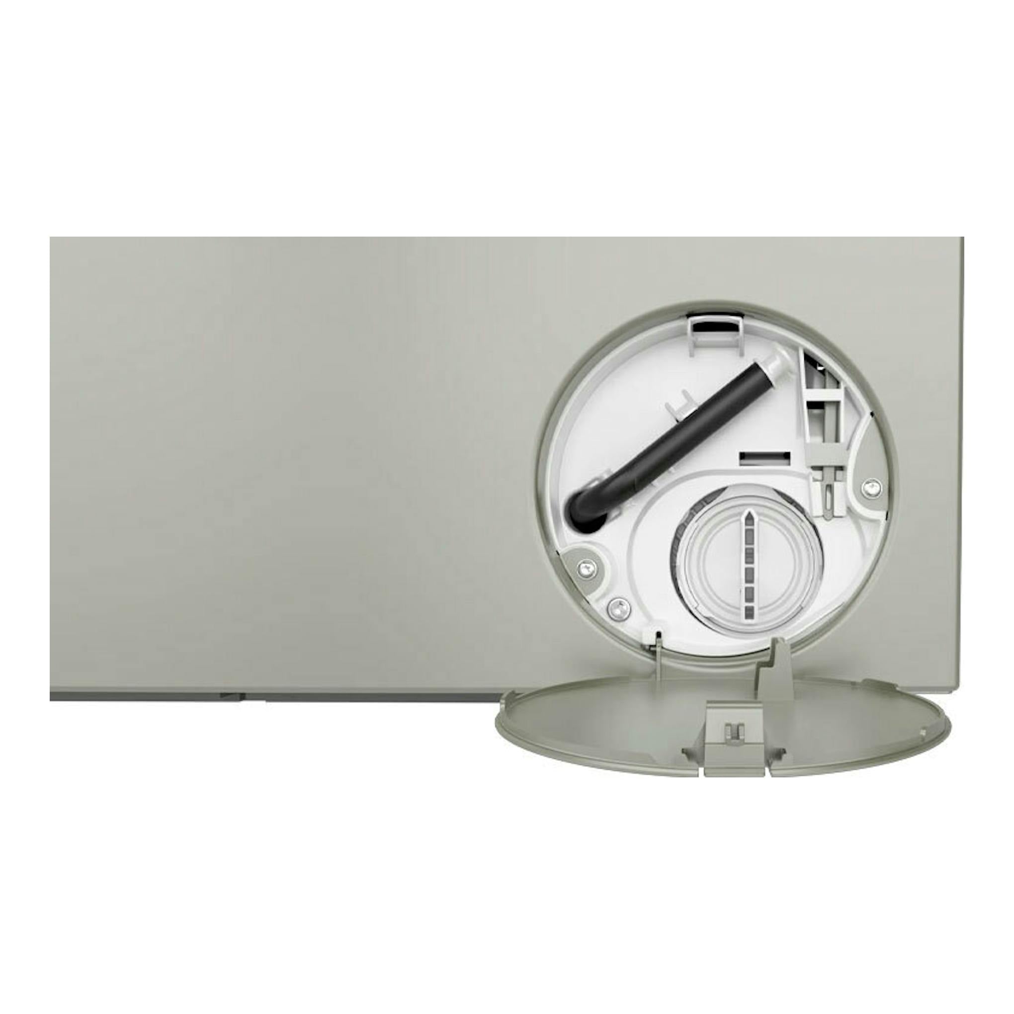Lavadora Siemens WG56H2AXES gris, vista frontal parcial con tapa inferior abierta y filtro visible.