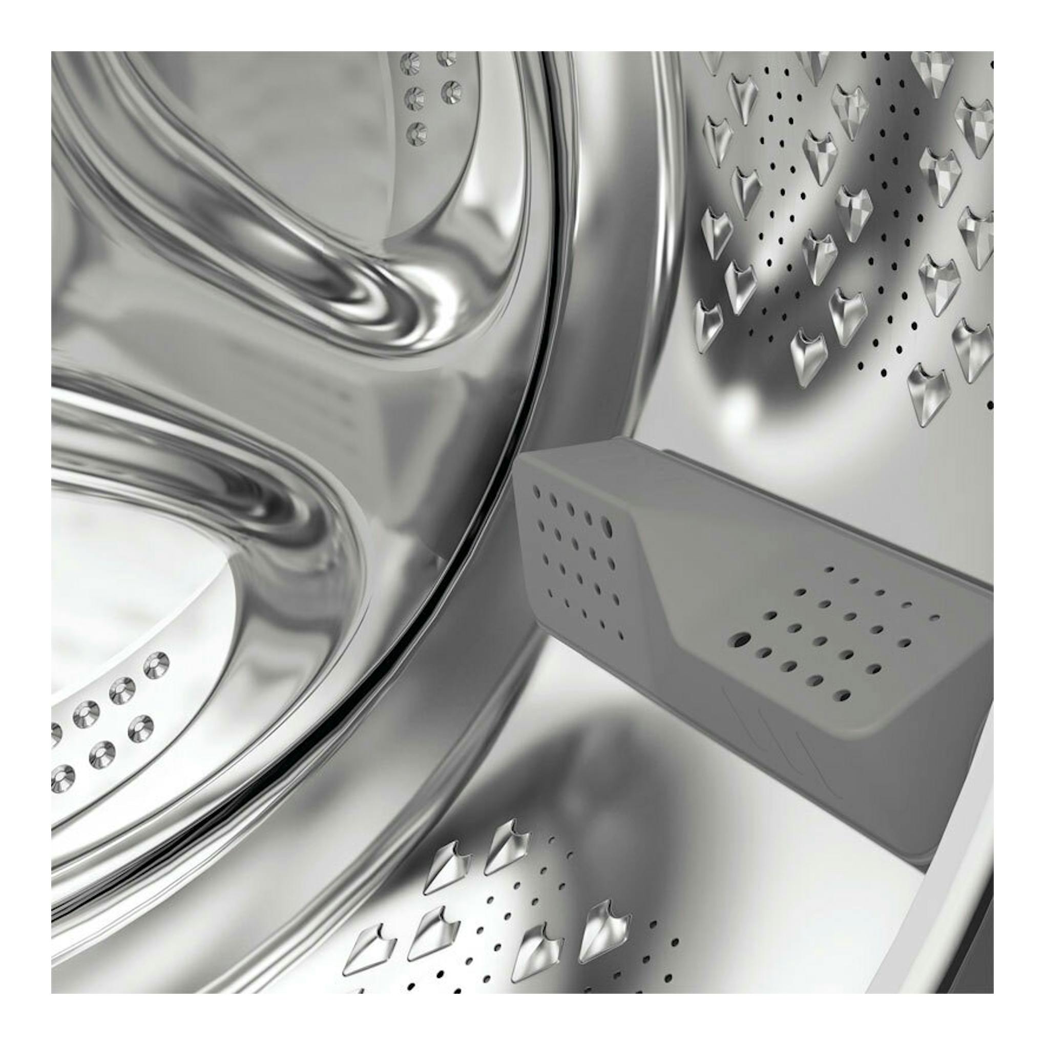 Interior de lavadora Whirlpool WPM97WADSSPT de acero inoxidable, vista en primer plano del tambor y aspas.