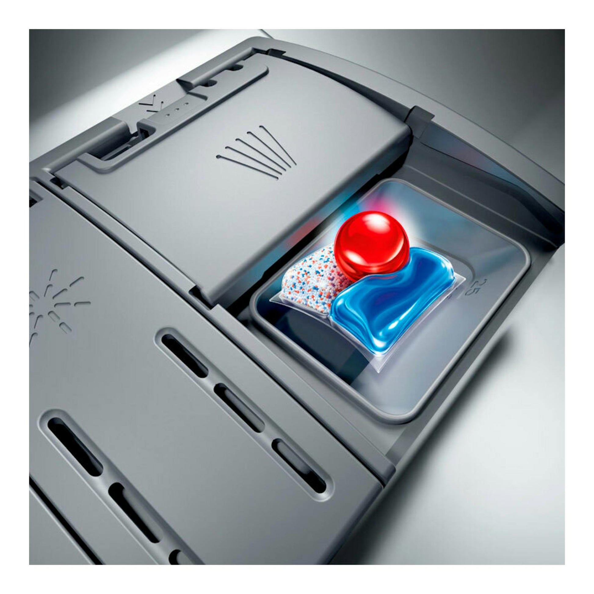 Bosch SMS4EKI06E: detalle del compartimento de un lavavajillas gris con cápsula azul y roja.