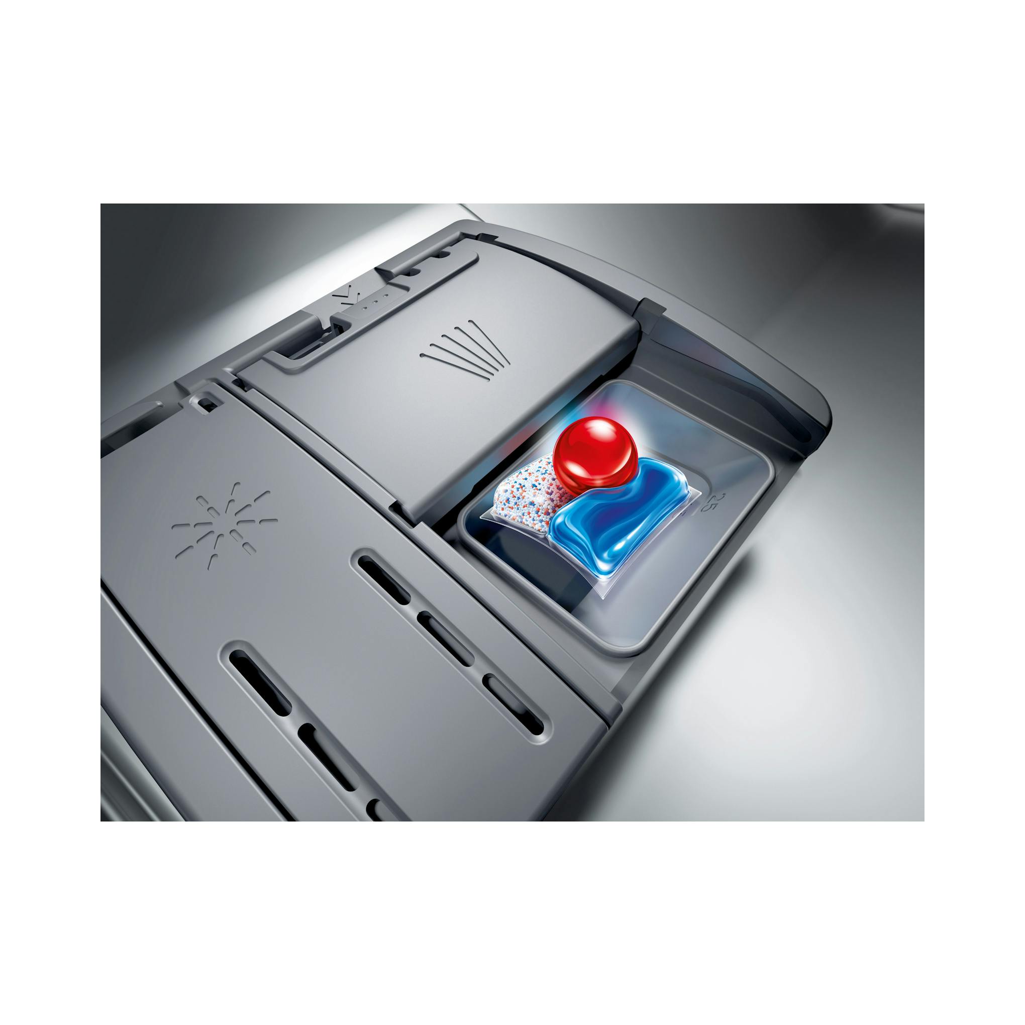 Detalle en vista cenital del compartimento de detergente de un lavavajillas Bosch SMV4ECX21E, en gris, con pastilla.