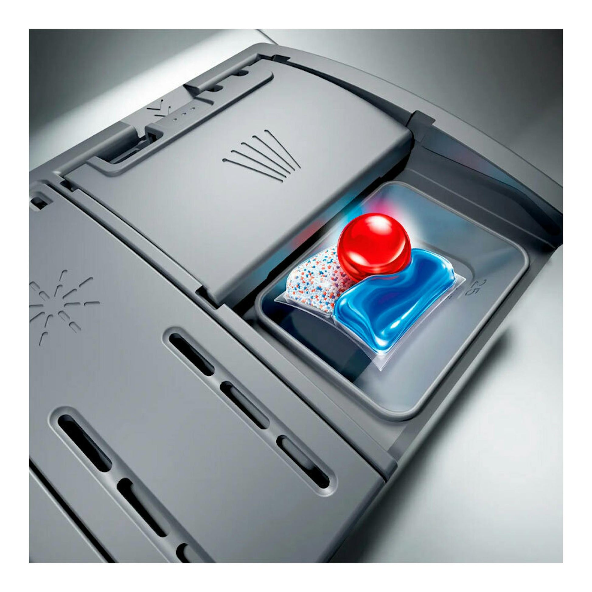 Compartimento de lavavajillas integrable Siemens SN97TX02CE con pastilla detergente, vista en primer plano.