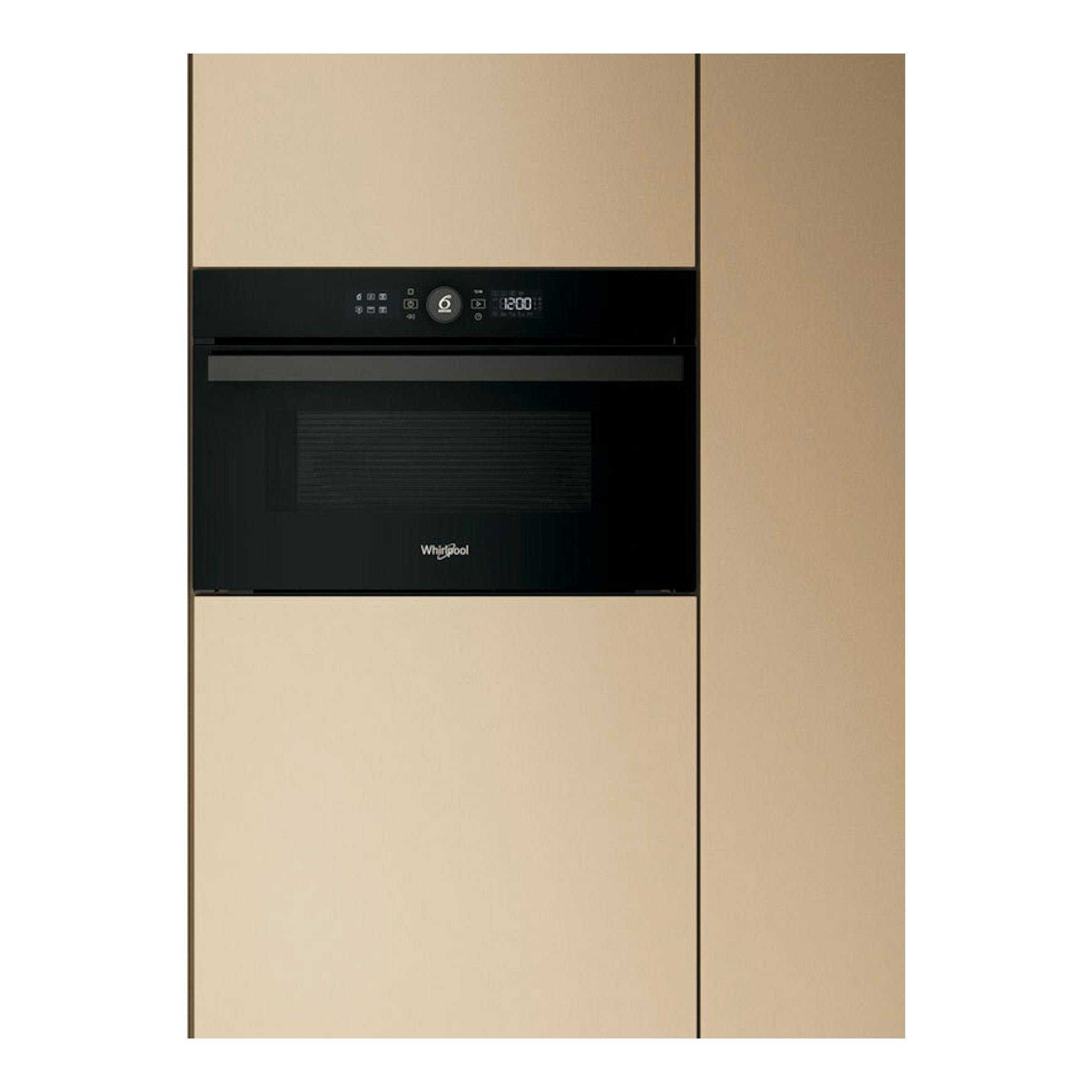 Microondas integrable Whirlpool WMD44MB negro, vista frontal, empotrado en mueble beige.