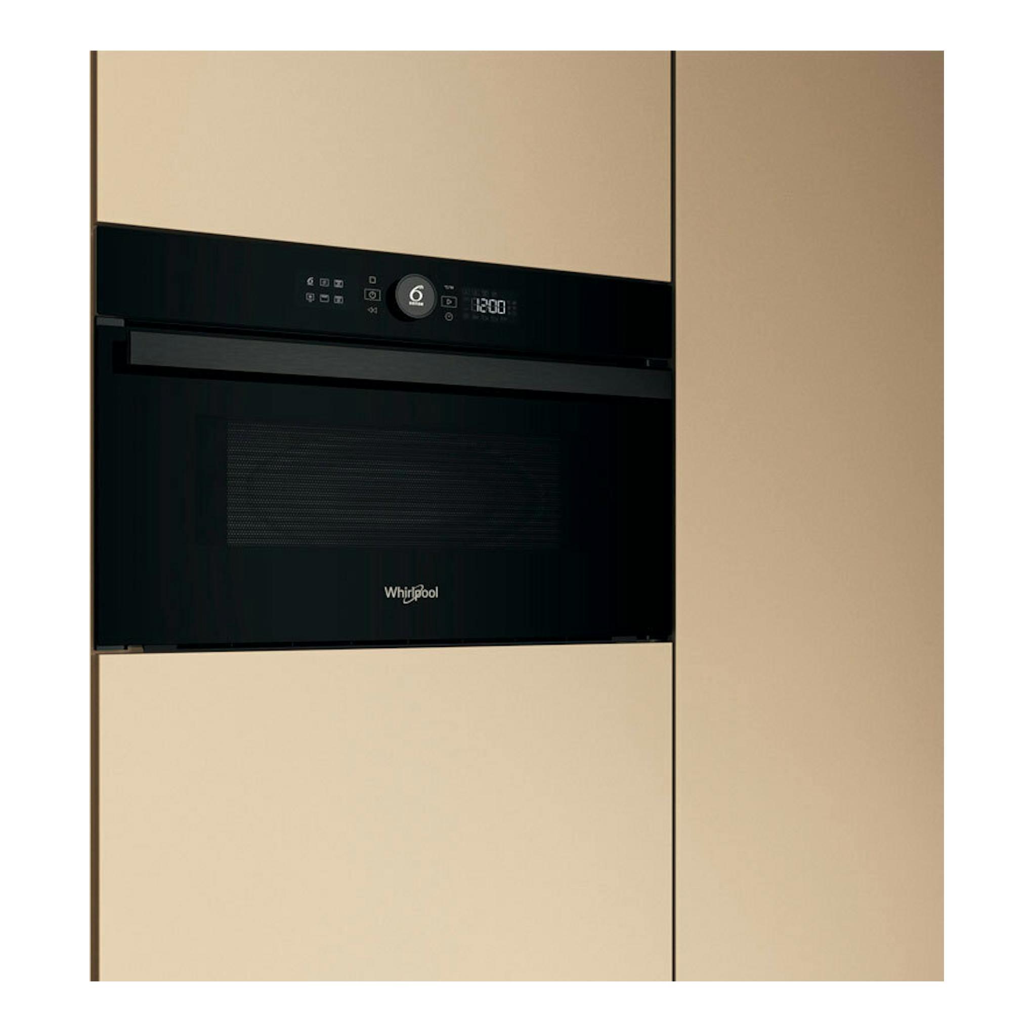 Microondas integrable Whirlpool WMD44MB negro, vista frontal, empotrado en mueble beige.