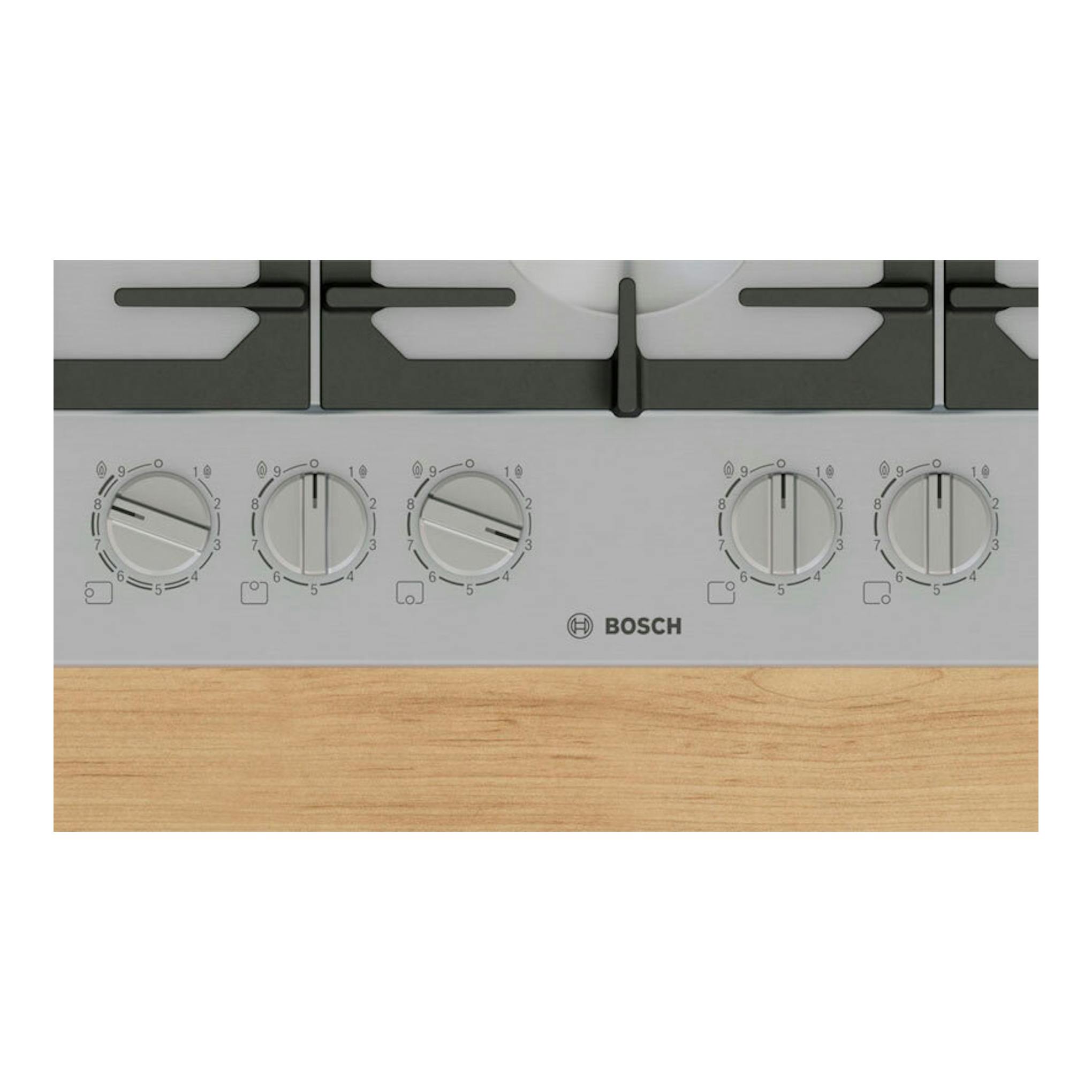 Placa de gas Bosch PCS7A5I90, vista frontal en acero, con cinco mandos y quemadores negros sobre encimera de madera.