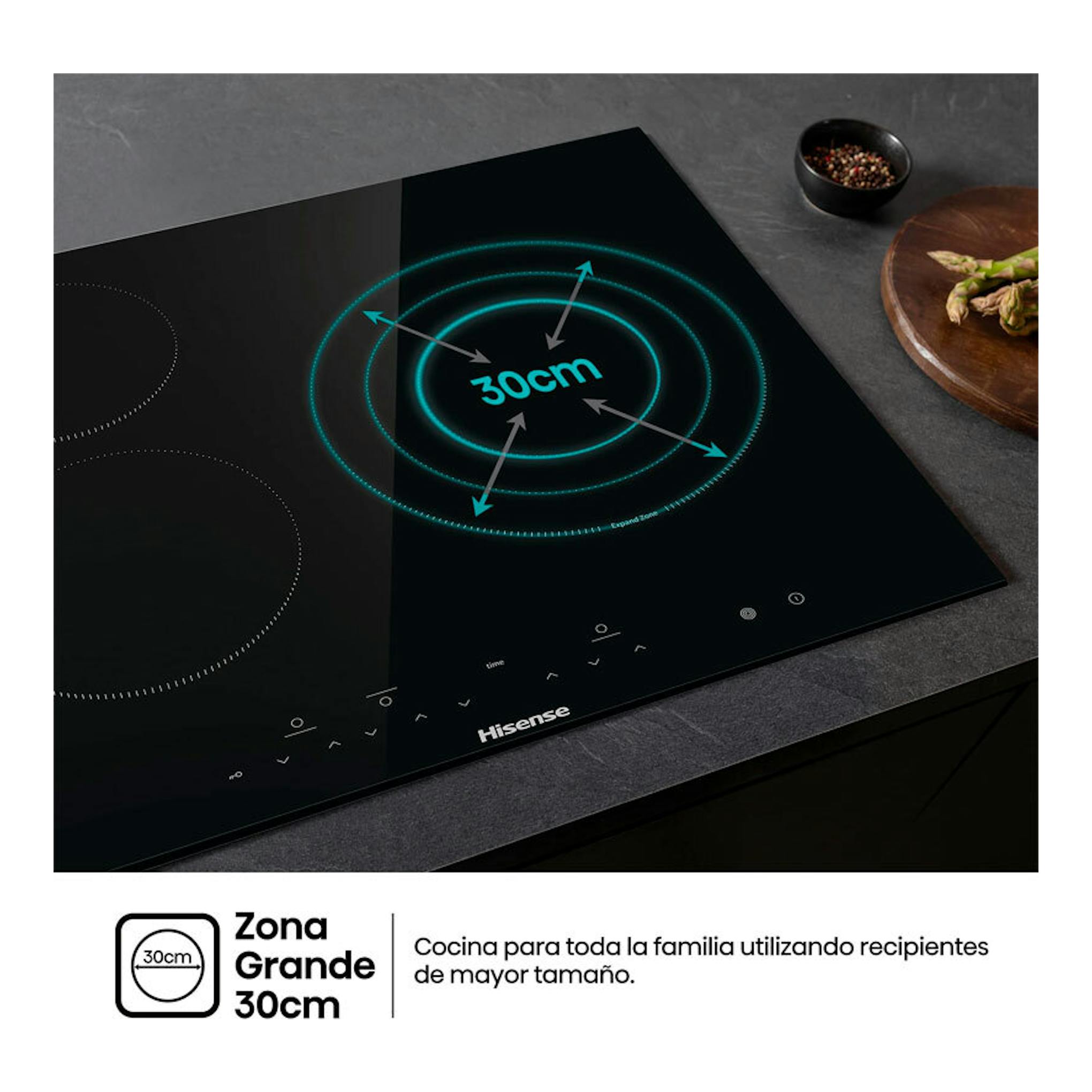 Placa vitrocerámica Hisense E6332BSCE negra, vista en ángulo, con zona grande de 30 cm.