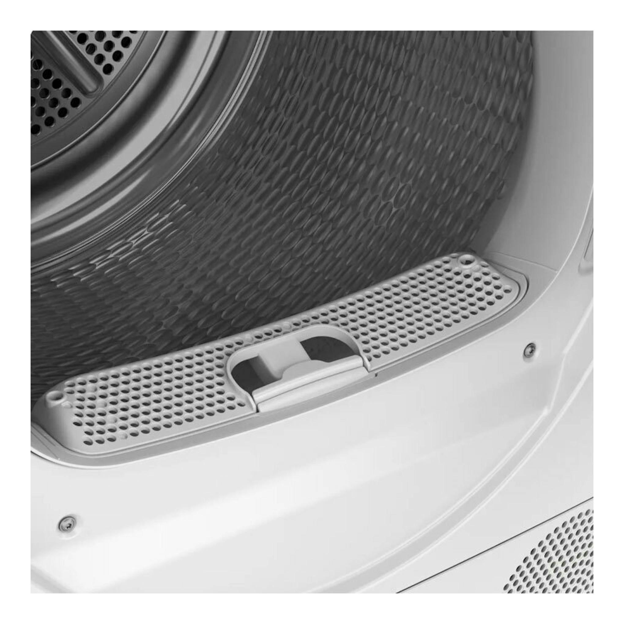 Secadora Siemens WQ45G2D0ES, primer plano del interior del tambor y filtro blanco perforado.