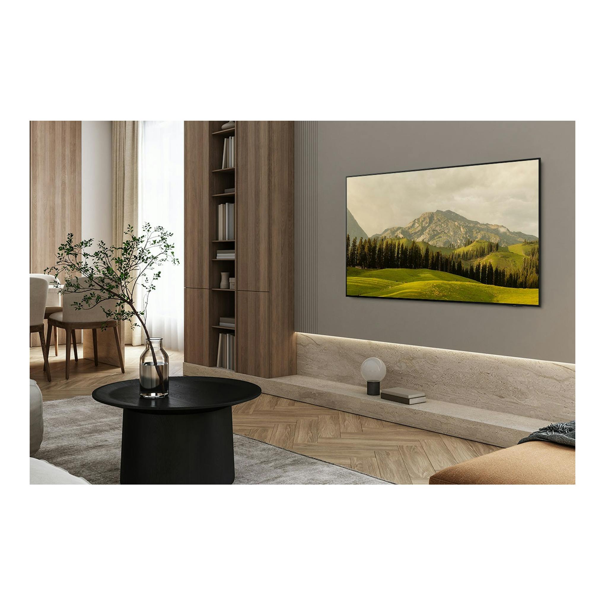 Televisor Samsung TQ55S85FAUXXC OLED 4K, vista frontal, montado en pared en una sala, con paisaje en pantalla.