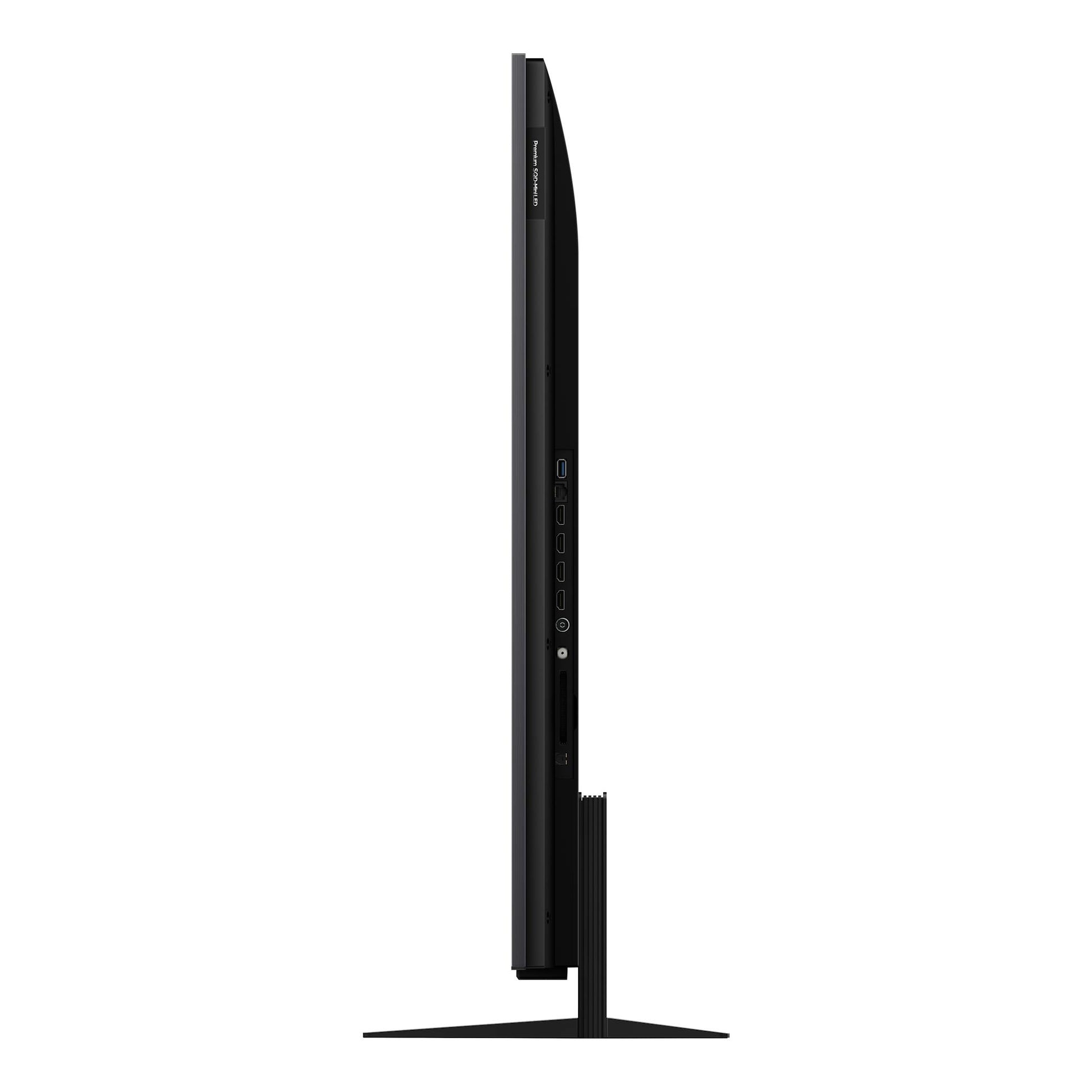 Televisor TCL 55C8L negro, vista lateral sobre base, con puertos HDMI y USB visibles.