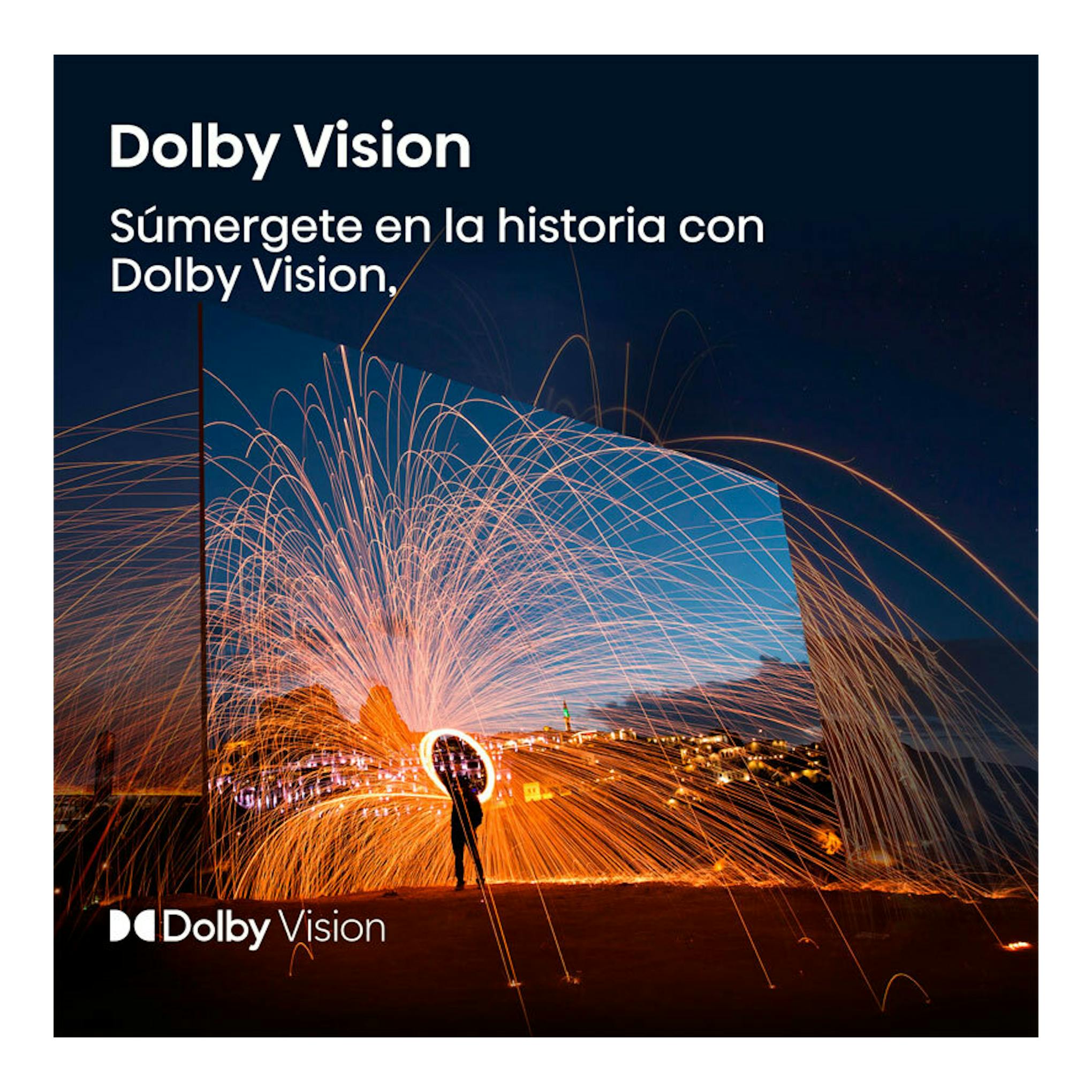 Anuncio de Dolby Vision en un televisor, con escena nocturna y trazos de luz naranja.
